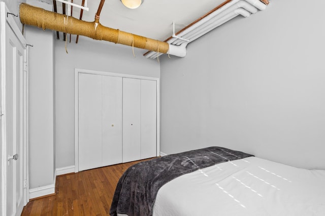 bedroom featuring a closet and wood finished floors