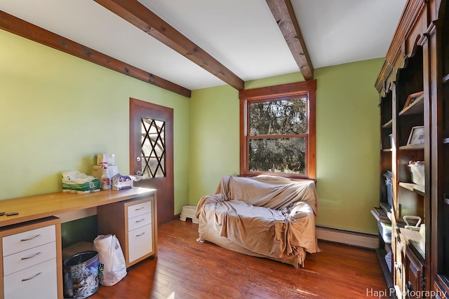 office space with beam ceiling, dark wood-style flooring, a baseboard radiator, and a wealth of natural light