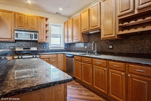 kitchen featuring open shelves, a sink, backsplash, appliances with stainless steel finishes, and dark wood-style flooring