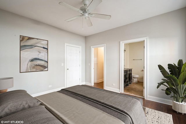 bedroom featuring ceiling fan, baseboards, ensuite bath, and wood finished floors