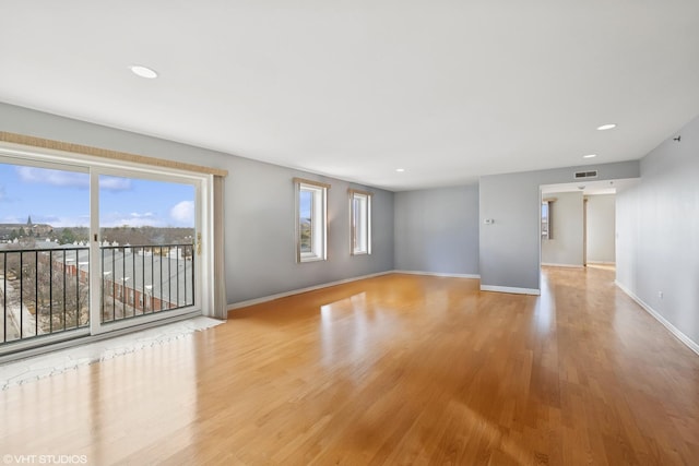 spare room featuring recessed lighting, visible vents, baseboards, and light wood finished floors