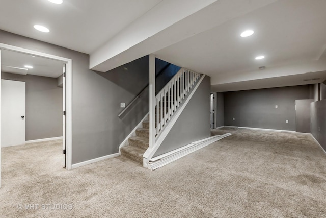 finished basement with stairs, baseboards, carpet flooring, and recessed lighting