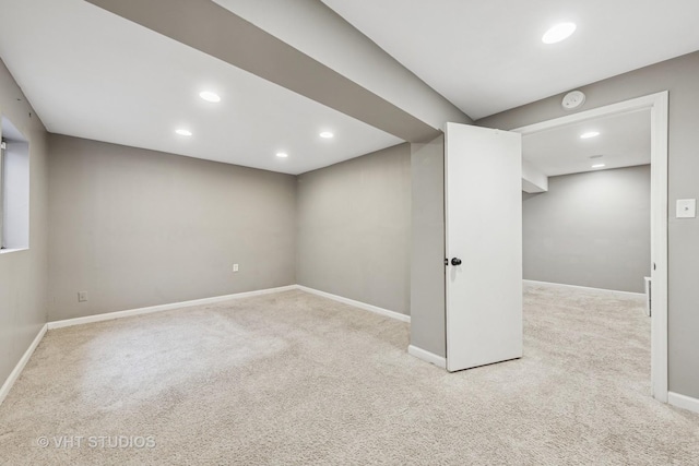 finished below grade area with baseboards, carpet floors, and recessed lighting