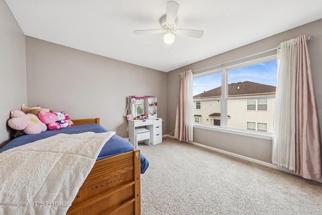 bedroom featuring a ceiling fan, carpet, and baseboards