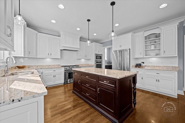 kitchen featuring dark brown cabinetry, dark wood-style floors, white cabinetry, high end appliances, and a sink