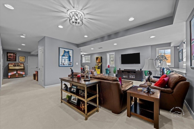 living area with recessed lighting, baseboards, and light carpet