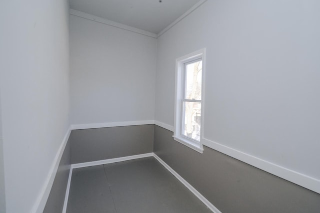 empty room with baseboards and ornamental molding