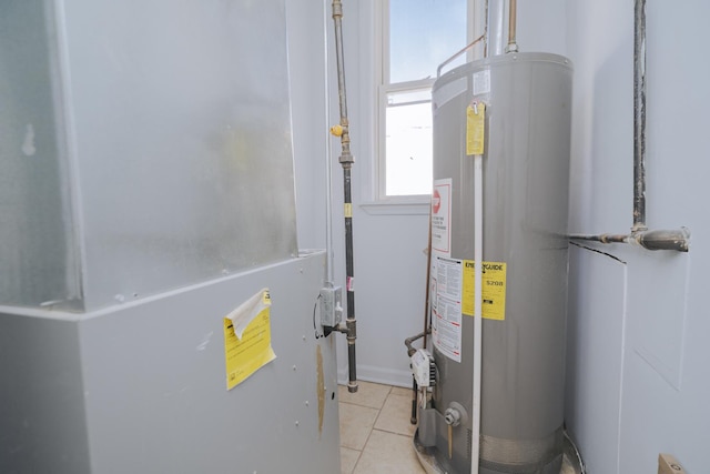 utility room featuring water heater and heating unit