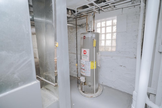 utility room featuring gas water heater