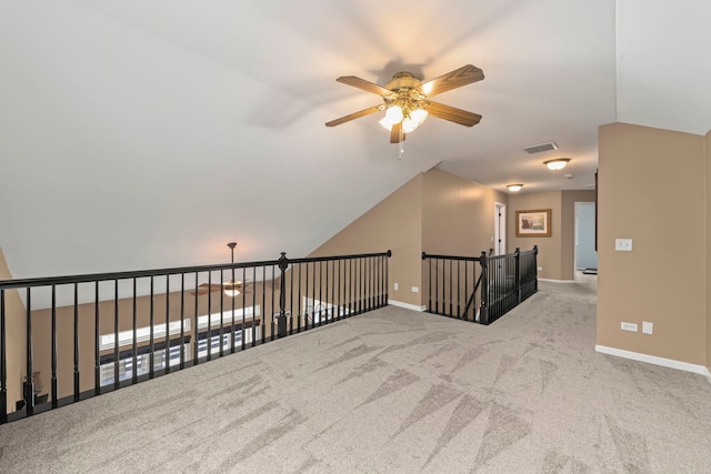 bonus room with baseboards, visible vents, a ceiling fan, lofted ceiling, and carpet flooring