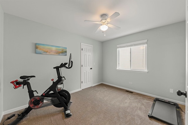 workout area with ceiling fan, carpet floors, visible vents, and baseboards