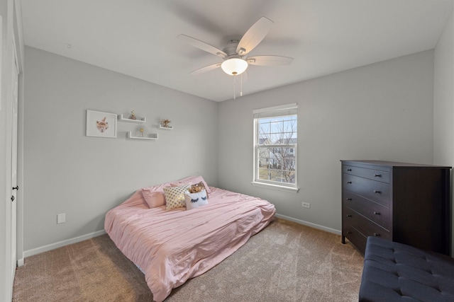 carpeted bedroom featuring ceiling fan and baseboards