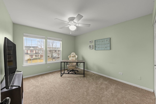 office area with carpet, ceiling fan, and baseboards