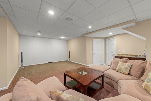 living area featuring carpet flooring, visible vents, and baseboards