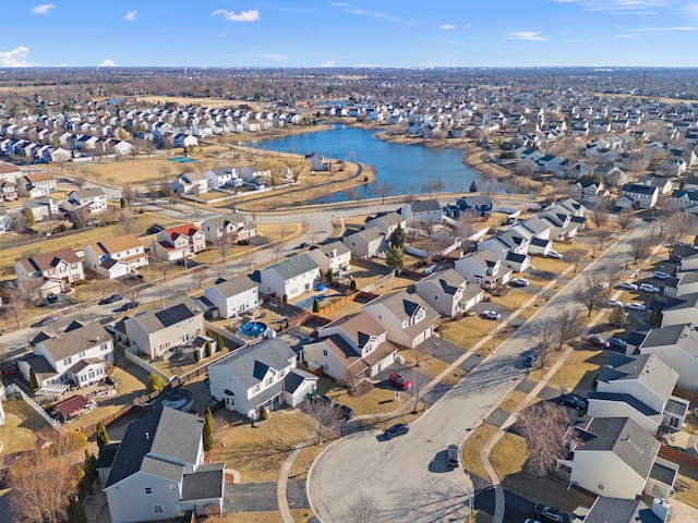 birds eye view of property with a residential view and a water view