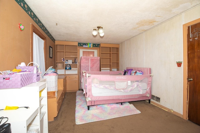 bedroom featuring visible vents and a textured ceiling