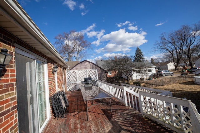 deck featuring a residential view and fence