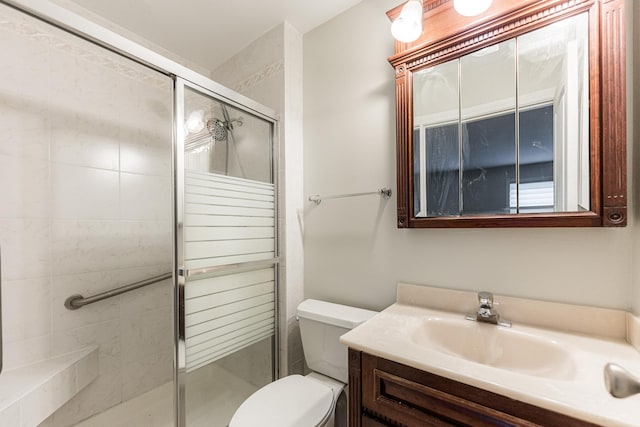 full bath featuring a shower stall, toilet, and vanity