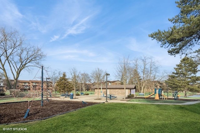 community jungle gym with a lawn