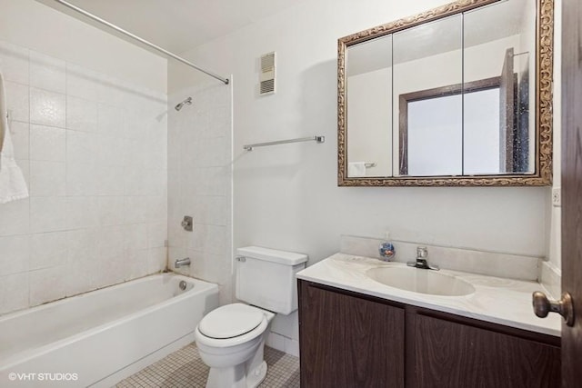 bathroom featuring shower / bathtub combination, toilet, vanity, visible vents, and tile patterned floors