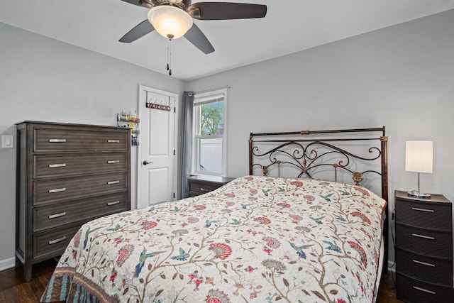 bedroom featuring dark wood-type flooring, baseboards, and ceiling fan