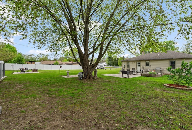 view of yard with a patio and a fire pit
