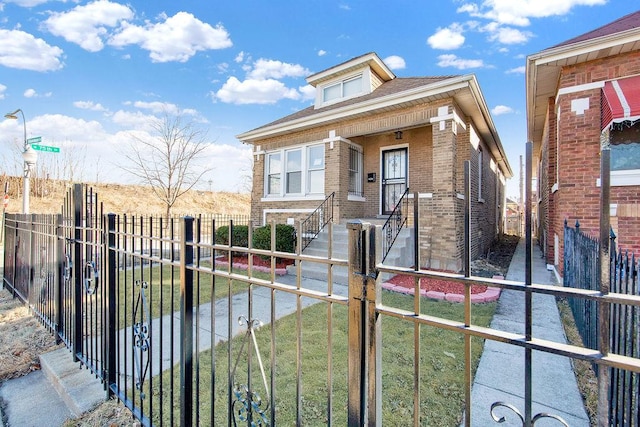 bungalow-style house featuring brick siding, a front lawn, and fence