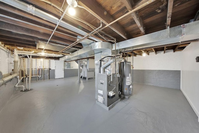 unfinished basement with gas water heater and heating unit