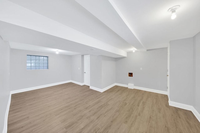 basement with wood finished floors and baseboards