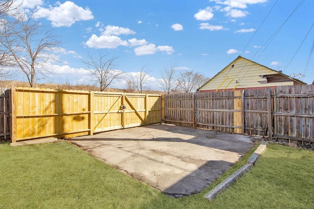 view of yard featuring fence and a patio