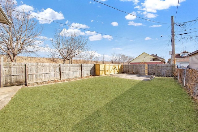 view of yard with a fenced backyard and a patio