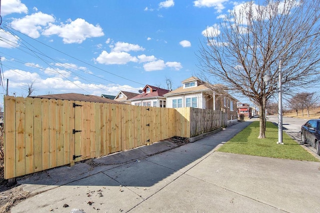 view of property exterior featuring a fenced front yard