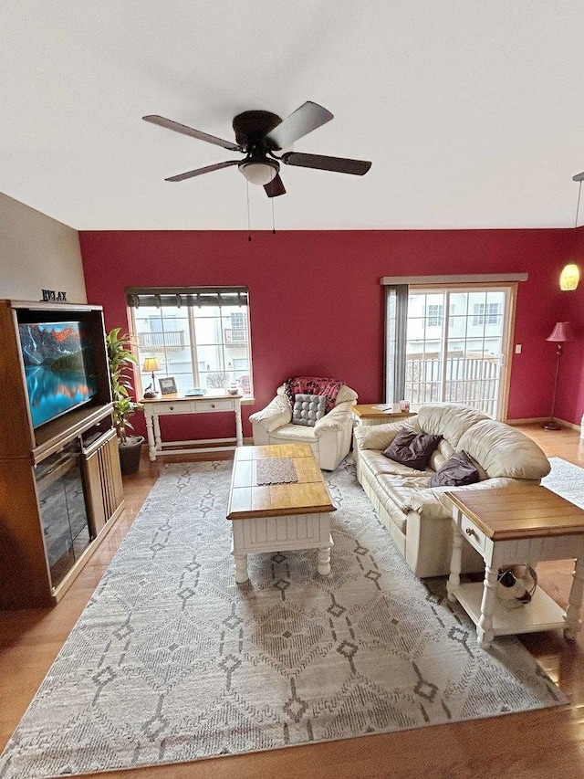 living area with ceiling fan