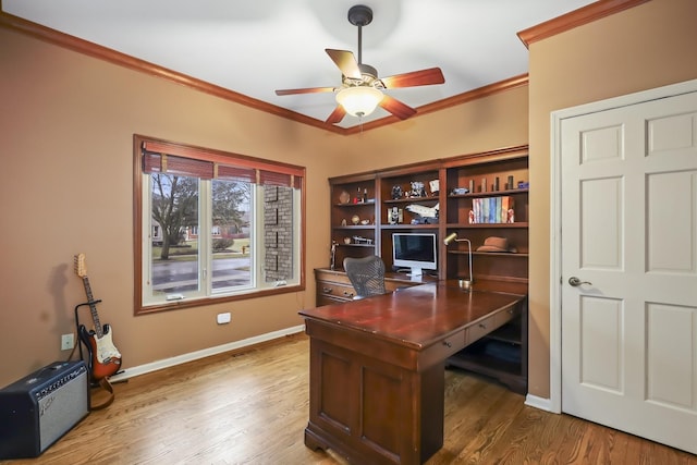 office area with a ceiling fan, baseboards, ornamental molding, and wood finished floors