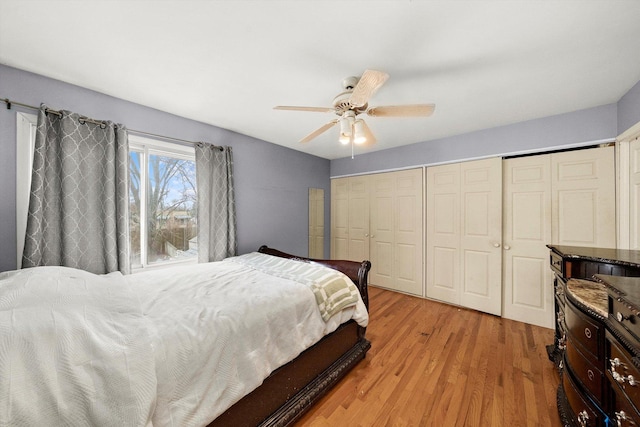 bedroom with a closet, ceiling fan, and light wood-style flooring