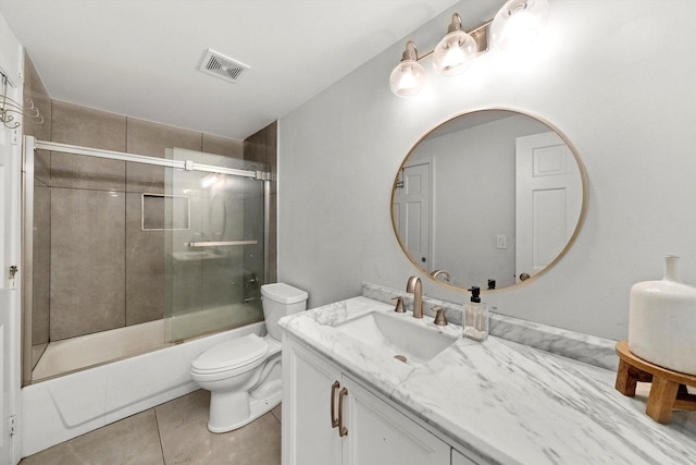 full bath featuring visible vents, toilet, combined bath / shower with glass door, vanity, and tile patterned flooring