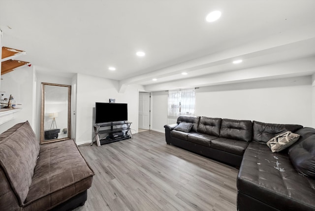 living room with recessed lighting, light wood-style flooring, and baseboards