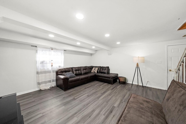 living room featuring baseboards, wood finished floors, beam ceiling, and recessed lighting