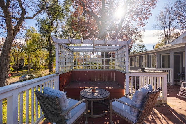 wooden deck with a sunroom