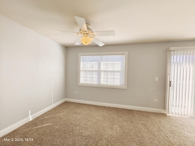 unfurnished room featuring a ceiling fan, baseboards, and carpet flooring