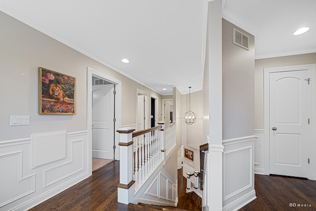 staircase featuring recessed lighting, wainscoting, crown molding, and wood finished floors