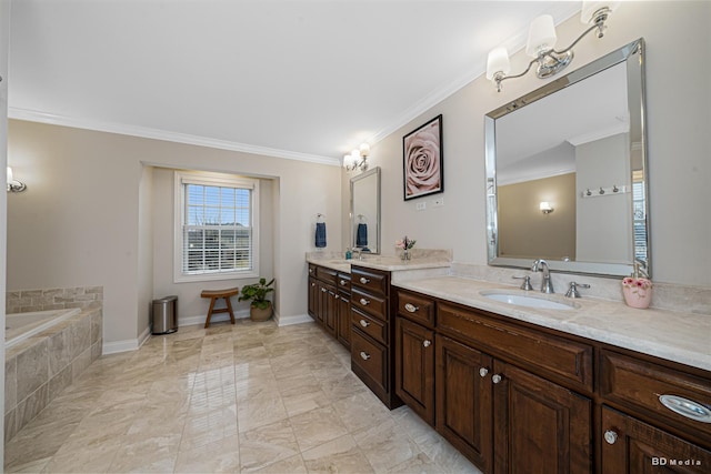 full bath with tiled bath, vanity, crown molding, and baseboards