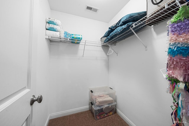 walk in closet with carpet flooring and visible vents