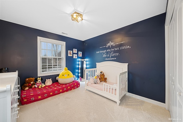 bedroom with visible vents, baseboards, and carpet