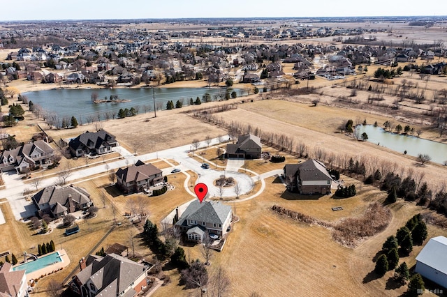 bird's eye view featuring a residential view and a water view