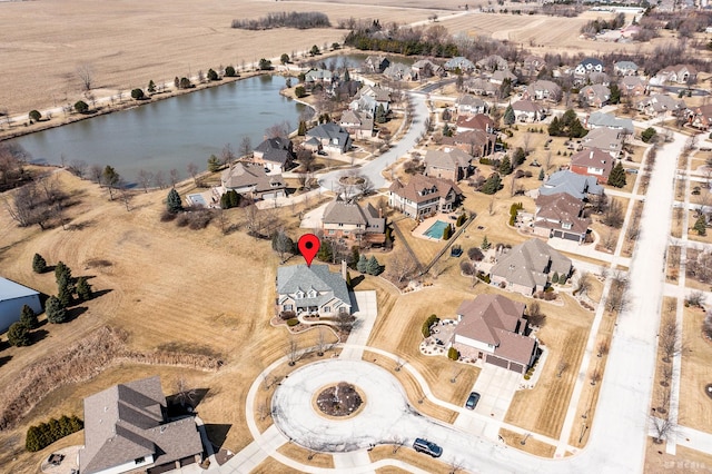 aerial view featuring a residential view and a water view