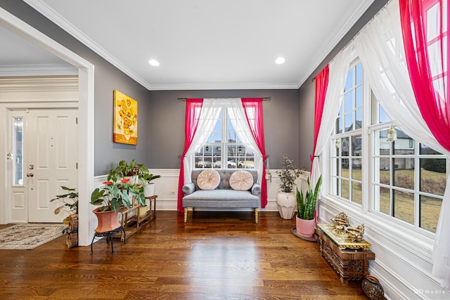 living area featuring recessed lighting, crown molding, and wood finished floors