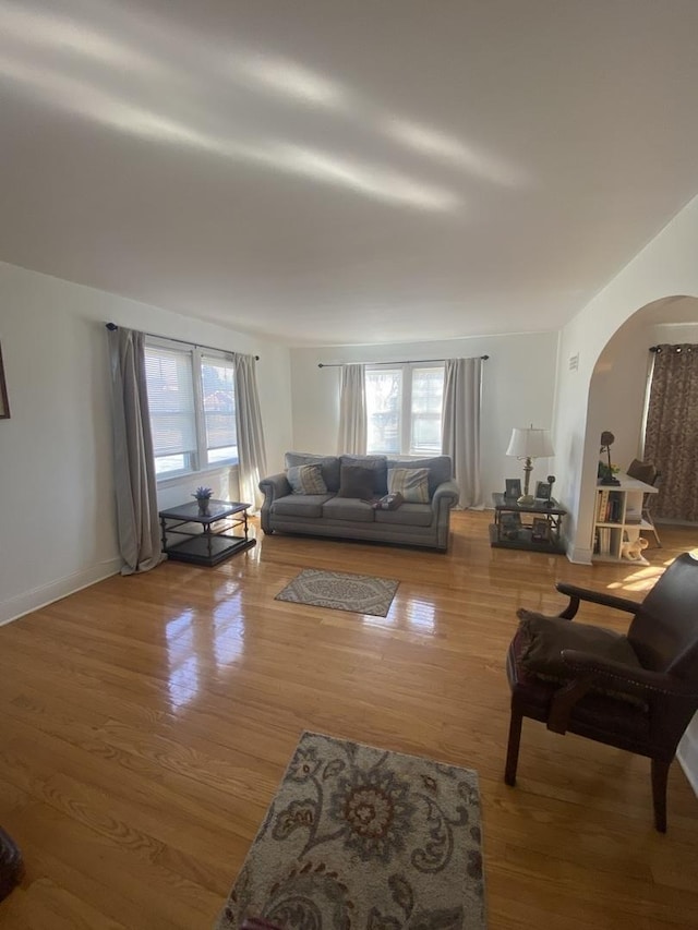 3300 N Osage Ave, Chicago, IL 60634 - living room featuring wood finished floors and arched walkways