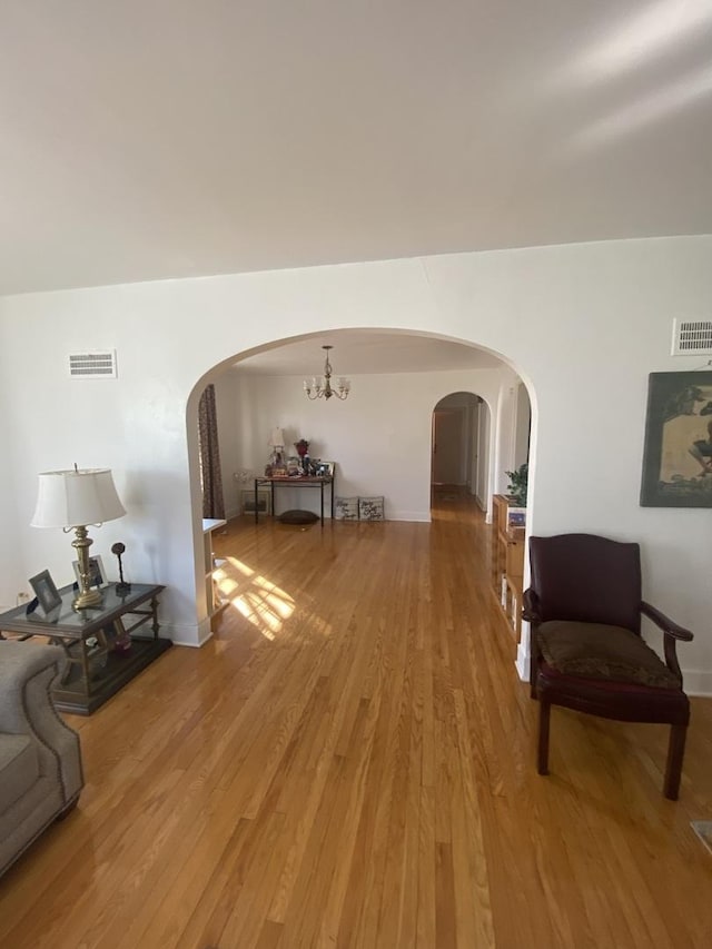 3300 N Osage Ave, Chicago, IL 60634 - interior space featuring light wood finished floors, visible vents, and arched walkways