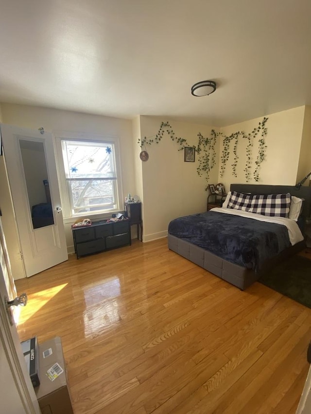 3300 N Osage Ave, Chicago, IL 60634 - bedroom with light wood finished floors and baseboards